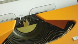 Close up footage of a person writing THE END on an old typewriter, with sound Stock Footage