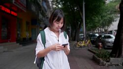 Women requesting taxi from a smart phone Stock Footage