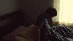 He wakes up in the morning, dark room silhouette light of the window. Stock Footage
