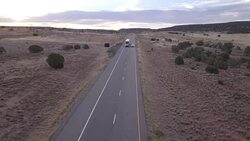 Aerial Drone Footage of Semi-Trucks Rolling Down the Highway Stock Footage