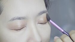 Professional make-up artist making up her model face Stock Footage