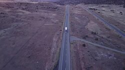 Aerial Drone Footage of Semi-Trucks Rolling Down the Highway Stock Footage