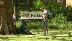 People relaxing and excercising in London Fields on a sunny day News Clip