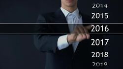 Businessman selects 2020 year in virtual menu, search for data, business history Stock Footage