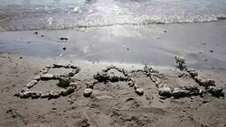 Bali written with coral on the sand at Crystal Bay beach at Nusa Penida Island, Indonesia Stock Footage