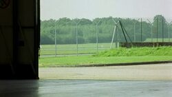 WIDE ANGLE OF PRIVATE JET, AIRPLANE PULLING IN TO HANGAR. PLANE IS HAWKER SIDDELEY HS 125-700B. Stock Footage
