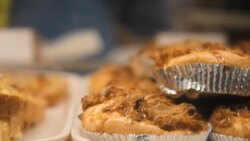 Showcase of cakes, breads,waffle, pastry in window display canteen for tasty desert food Stock Footage