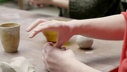 Female students shaping clay in pottery studio Stock Footage