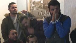 CLEAN : Tunisia fans watch in capital as Algeria wins Arab Cup Final News Clip