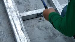 Young man working with hammer. Installation Lower base of prefabricated houses. video Slow Motion Stock Footage
