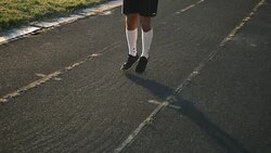 Mixed race man athlete warming up legs before running or work out Stock Footage