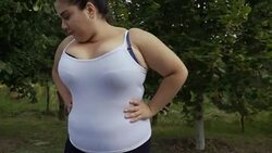 Fat girl runs along the road Stock Footage