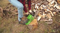 Lumberjack fixing / maintain the chainsaw outdoors. Stock Footage