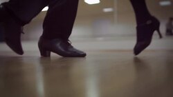 Dancing male and female legs in the dance studio Stock Footage