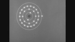 1950s: Illustrated copper atom Stock Footage