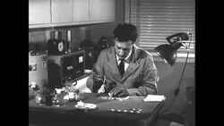 Researchers use lead shield in radiation dust experiment at UCLA's Atomic Energy Project News Clip