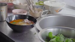 Close up shot of a man cooking Noodle dish. Street food in Chinatown of Bangkok, Thailand Stock Footage