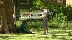 People relaxing and excercising in London Fields on a sunny day News Clip