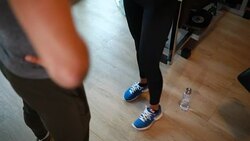 Fit woman exercising at a gym with a personal trainer Stock Footage