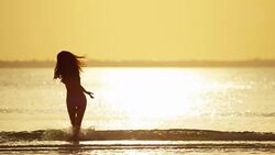 Ethnic female in swimwear on tropical ocean beach Stock Footage