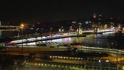 Night traffic speeds in metropolis, illuminated city, blurred lines, busy life Stock Footage