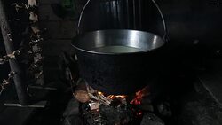 Steaming old-fashion pot over fire Stock Footage