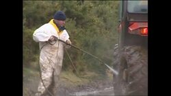 Workers spraying farm equipment following the outbreak of foot and mouth disease News Clip