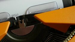 Close up footage of a person writing EPILOGUE on an old typewriter Stock Footage
