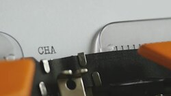 Close up footage of a person writing CHAPTER I on an old typewriter, with sound... Stock Footage