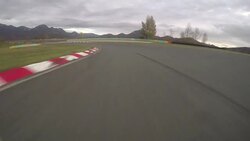 POV: Driving a fast car along the scenic asphalt racetrack on a cloudy evening. Stock Footage