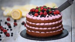 Chocolate cake with summer berries. Cutting chocolate cake Stock Footage