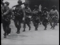 Eisenhower visits paratroopers prior to Normandy. Troops load up and board planes. 1944 Stock Footage