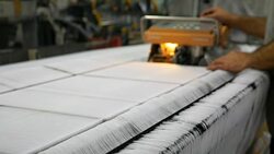 Technician is doing maintenance and repair of weaving loom machines in textile factory Stock Footage