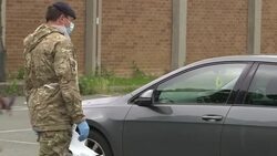 Army conducting coronavirus tests at a drive through centre News Clip