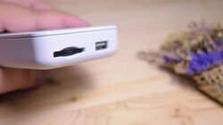 Close-up of a man's hand is plugging a micro sd card into the reader to retrieve the data with soft focus scene. Stock Footage