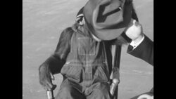 A trained chimp in Detroit in the 1930s News Clip