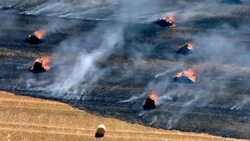 Hay bales burn in aggressive wildfire News Clip