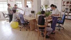 Creative designers working and planning in open plan office Stock Footage