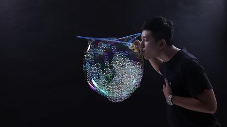 Most Soap Bubbles Blown Inside One Large Bubble
