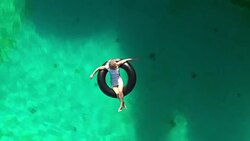 Relaxation in a swimming pool Stock Footage