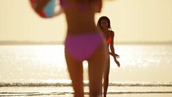 African American Asian Chinese girls on tropical beach Stock Footage