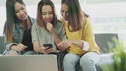 Attractive young asian girl group looking at smartphone with happy smiling and laughing fun in best friend concept. Stock Footage
