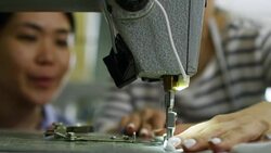 Hands of Woman Using Sewing Machine Stock Footage