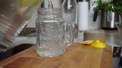 Young woman pouring lemonade Stock Footage