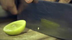 cutting green lemon close up shot Stock Footage