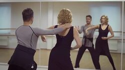 Man and a woman are dancing in the studio Stock Footage