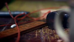 Red string is placed next to a ruler, chalk and workshop tools on a workbench. Stock Footage