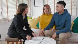 Realtor explain asian couple about contract and husband sign home contract at new home.buying new house real estate Stock Footage