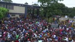 Migrants force through fence as they try to cross border into Mexico Instructional Video