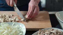 Woman cutting chicken meat Stock Footage